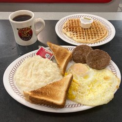 Waffle House - All-Star special and coffee (Eggs over medium, sausage, grits, white toast w/ butter and strawberry jam and pecan waffles.