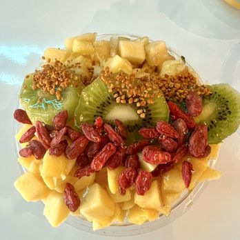 Playa Bowls - Mango bowl with goji berries kiwi mango bee pollen and pineapple - Acai Bowls Near Me - Royal Palm Beach, Florida Playa Bowls - Mango bowl with goji berries kiwi mango bee pollen and pineapple - Acai Bowls Near Me - Royal Palm Beach, Florida