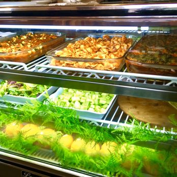 Green Table Cafe - Case with specials of the day. L-R vegan meatballs marinara, pasta dish, and vegan lasagna - Cafes Near Me - Los Angeles, California
