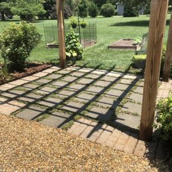 Mooe's Landscaping & Pest Control - MLP repaired, pressure washed and treated the pergola, then planted pink chintz thyme between the pavers. replaced red clay with pea gravel