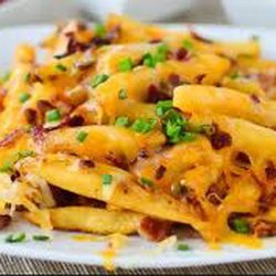 Delicias Mexicanas - Azada fríes French fries,azada beef, cheddar cheese, nacho cheese, onion and jalapeño