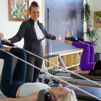 Movewell - Instructor Islay teaching a small class on the reformers. - Pilates Near Me - Arcata, California Movewell - Instructor Islay teaching a small class on the reformers. - Pilates Near Me - Arcata, California