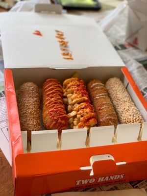 Two Hands Corn Dogs by null