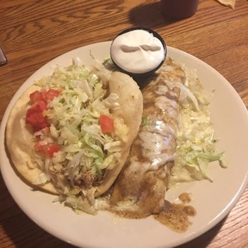 Trini's - Tasty puffy chicken taco and chicken enchilada with a side of sour cream - Mexican Near Me - Omaha, Nebraska Trini's - Tasty puffy chicken taco and chicken enchilada with a side of sour cream - Mexican Near Me - Omaha, Nebraska