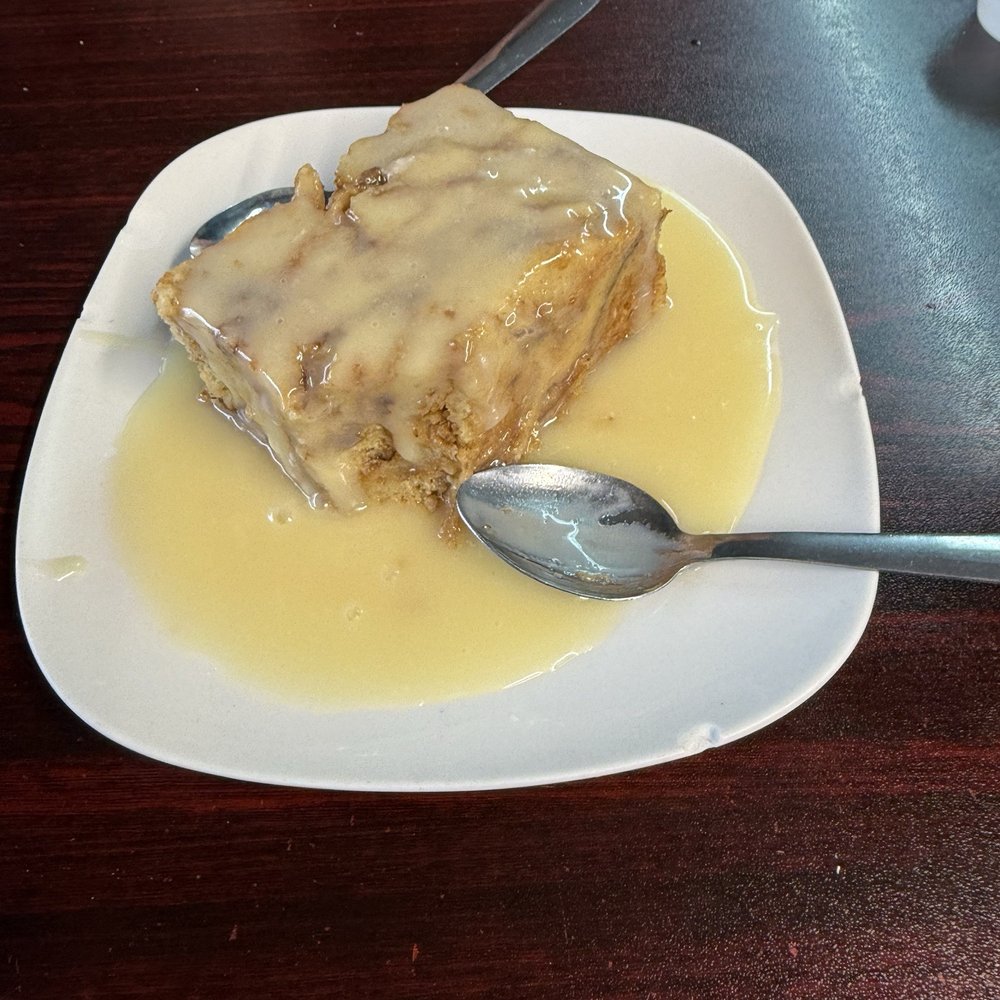 Pawpaw's Catfish Kitchen - Bread pudding with white chocolate sauce. - Cajun/Creole Near Me - Sevierville, Tennessee Pawpaw's Catfish Kitchen - Bread pudding with white chocolate sauce. - Cajun/Creole Near Me - Sevierville, Tennessee