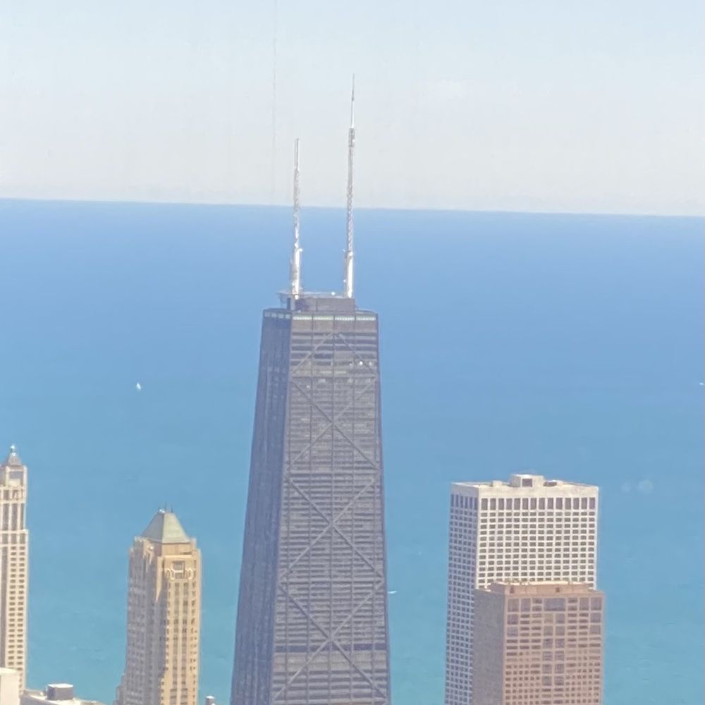 Skydeck - Looking down on John Hancock Center 1,128 feet tall - Observatories Near Me - Chicago, Illinois Skydeck - Looking down on John Hancock Center 1,128 feet tall - Observatories Near Me - Chicago, Illinois