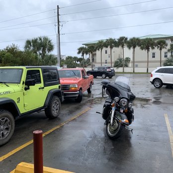 Tom Thumb - a motorcycle parked in a parking lot - Gas Stations Near Me - Santa Rosa Beach, Florida