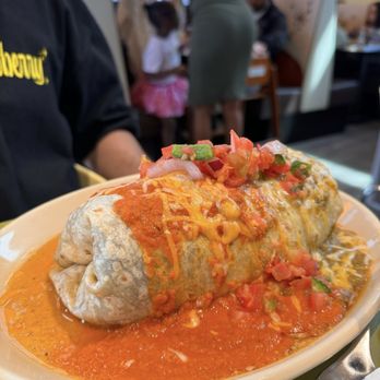 Snooze, an A.M. Eatery - Snooze breakfast burrito: chorizo, eggs, hash browns, beans, cheese inside with both green chile and habanero red sauce on top. - Breakfast & Brunch Near Me - Alpharetta, Georgia Snooze, an A.M. Eatery - Snooze breakfast burrito: chorizo, eggs, hash browns, beans, cheese inside with both green chile and habanero red sauce on top. - Breakfast & Brunch Near Me - Alpharetta, Georgia
