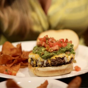Boston Burger - Somerville - Never mind the boobs in the background, it's all about the burgers here! - Burgers Near Me - Somerville, Massachusetts