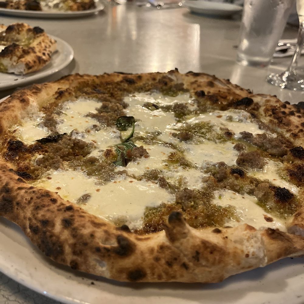 Scott's Pizza Tours - a whole pizza on a plate - Pizza Near Me Scott's Pizza Tours - a whole pizza on a plate - Pizza Near Me