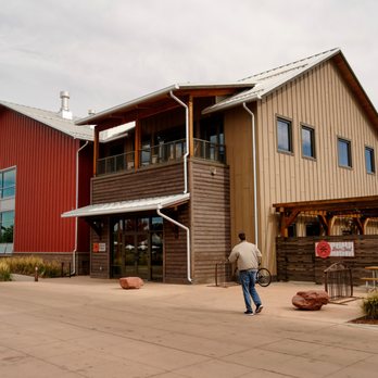Breckenridge Brewery - a man walking in front of the building - Breweries Near Me - Littleton, Colorado Breckenridge Brewery - a man walking in front of the building - Breweries Near Me - Littleton, Colorado