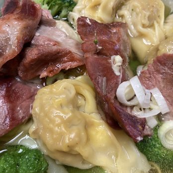 Wei-Li - Super Wonton Noodle Soup - A bowl of wonton noodle soup featuring wontons, sliced meat, broccoli, and chopped green onions in clear broth. - Chinese Near Me - Auburn, Maine