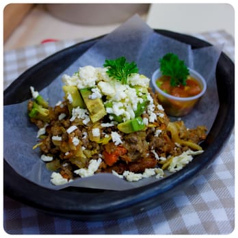 Cookie Martinez - Patacon Pisao (green deepfried pantains with beef/chicken/veggie, avocado and cheese) - Colombian Near Me - Toronto, Ontario