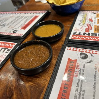 Amelias Mexican Kitchen - Salsas n chips moderate heat in red . Light chipotle in yellow dip - Mexican Near Me - Tucson, Arizona