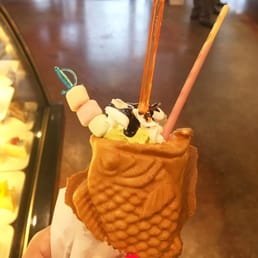 Taiyaki filled with custard and matcha green tea ice cream Taiyaki filled with custard and matcha green tea ice cream