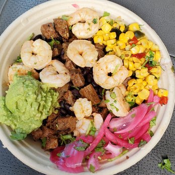 QDOBA Mexican Eats - Surf and Turf bowl, comes with steak and shrimp over rice and beans. Added Mexican corn, guacamole, pickled onions. Really good. - Mexican Near Me - Hauppauge, New York