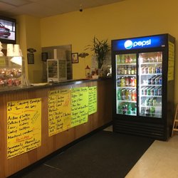 Dutch Pot Jamaican Restaurant - Menus are easy to read along with menus on the tables. Large selection of soft drinks