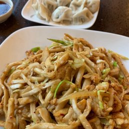 Noodles with shredded cabbage, sliced onion, chopped celery and chicken