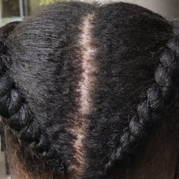 This was suppose to Ghana braids ! The part isn't even straight ! DO NOT GO HERE