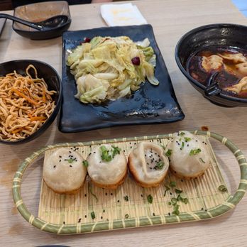 Dumpling World - Tofu noodles, wok-fried cabbage, hot and sour dumplings, fried soup-filled baos. - Dim Sum Near Me - Houston, Texas Dumpling World - Tofu noodles, wok-fried cabbage, hot and sour dumplings, fried soup-filled baos. - Dim Sum Near Me - Houston, Texas