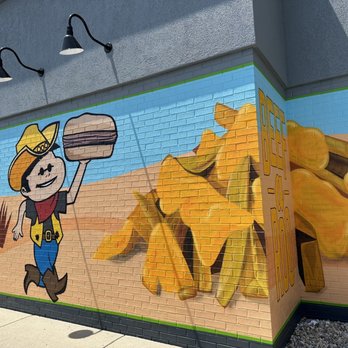 Beef-a-Roo - ows a mural of a man holding a tray of food - Salad Near Me - Lebanon, Indiana