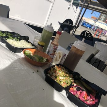 Zamora Carnitas - Self serve condiments on table - Food Trucks Near Me - Oakland, California