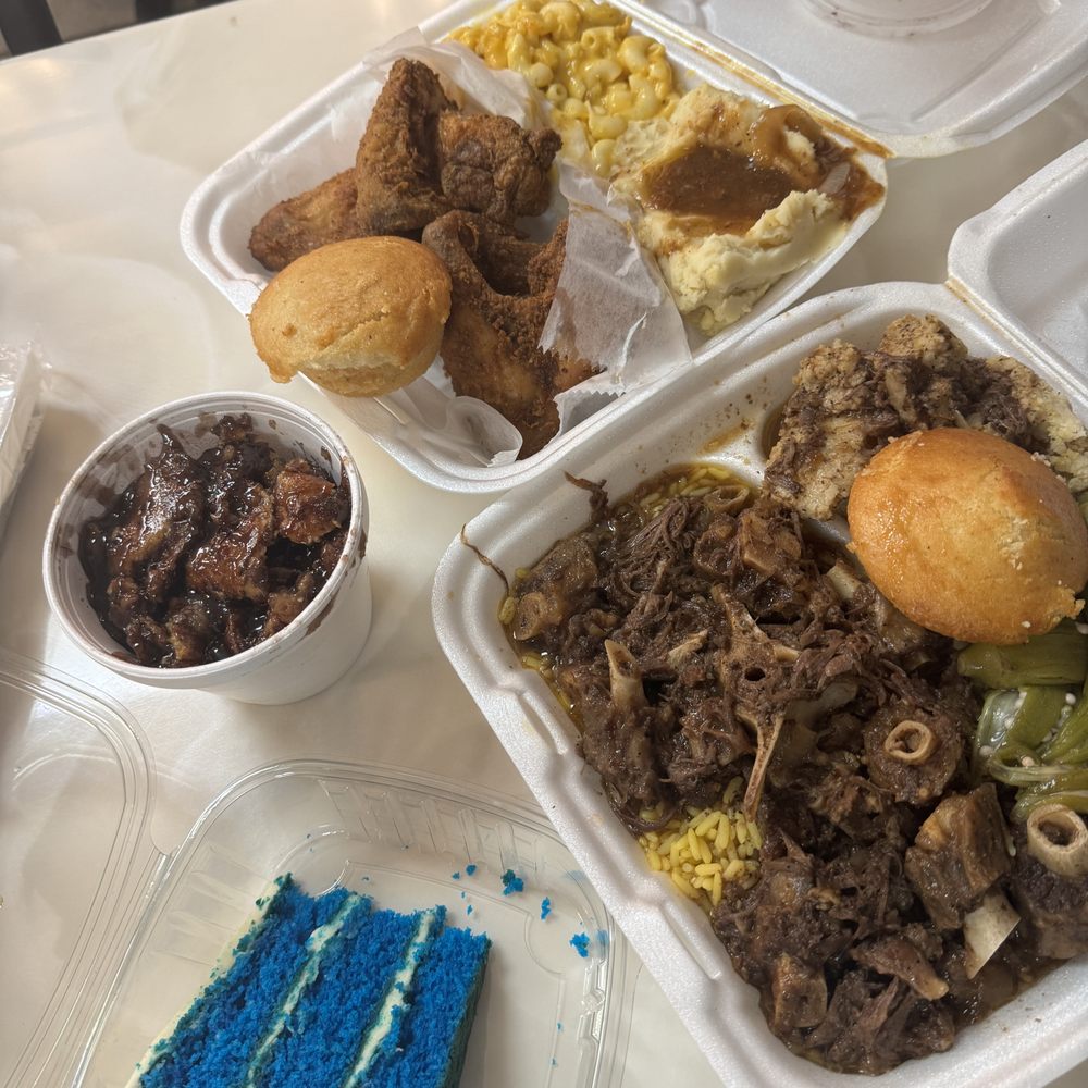 Big Daddy's Kitchen - oxtail with okra and fried chicken with mac and cheese and mashed potatoes in the back - Soul Food Near Me - Atlanta, Georgia