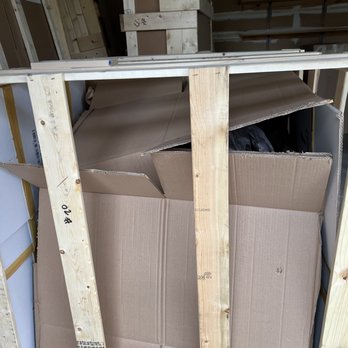 Cosmos Transport - Crate placed and side and damaged chandelier - Movers Near Me - Jacksonville, Florida