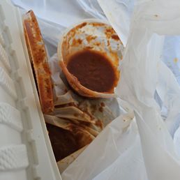 Enchilada sauce?? Didn't get that lid on....now bag is swimming and leaking in my car. Enchilada sauce?? Didn't get that lid on....now bag is swimming and leaking in my car.