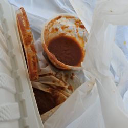 Maria's Mexican Restaurant - Enchilada sauce?? Didn't get that lid on....now bag is swimming and leaking in my car.