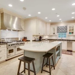 Designer Baths & Kitchens - Beautiful white kitchen with contrasting blue Island