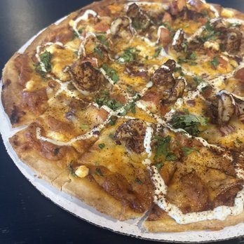 Bootleggin’ 3rd Gear - a pizza on a table - Pizza Near Me - St. Louis, Missouri Bootleggin’ 3rd Gear - a pizza on a table - Pizza Near Me - St. Louis, Missouri