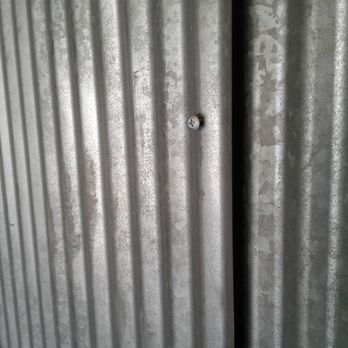 Public Storage - Notice the screw is loose. That black slit is the gap in the wall leading to another unit. - Self Storage Near Me - Shawnee, Kansas
