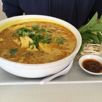 Basilic Vietnamese Grill - Chicken Curry Noodle Soup served with mint and parsley, lime, and fish sauce. - Vietnamese Near Me - Boca Raton, Florida Basilic Vietnamese Grill - Chicken Curry Noodle Soup served with mint and parsley, lime, and fish sauce. - Vietnamese Near Me - Boca Raton, Florida