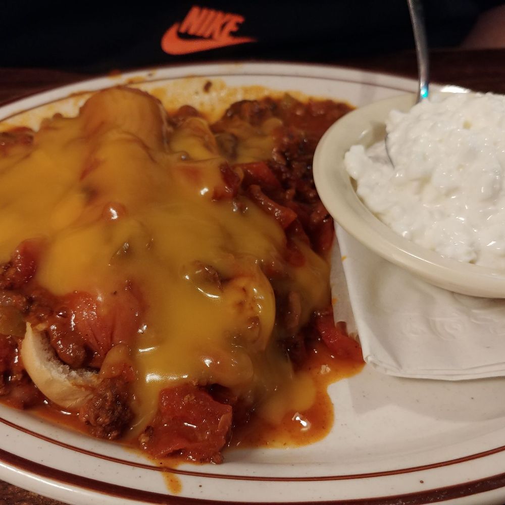 Hitchin Post Grill - Chili dog with cheese sauce and cottage cheese. - New American Near Me - Bevington, Iowa
