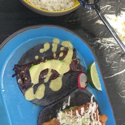 Baja Fish Taco (right) Filet Mignon Taco (left) Traditional Black Beans Herb Lime Rice Baja Fish Taco (right) Filet Mignon Taco (left) Traditional Black Beans Herb Lime Rice