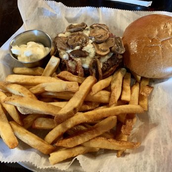 Boot Jack Tavern - Burger with Blue Cheese, Mushrooms, and a side of fries - Bars Near Me - Manitou Beach, Michigan