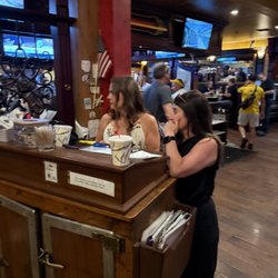 Grasshopper Irish Pub & Restaurant - The angry hostess and her crony while we waited. Totally unaware of how restaurant seat is accomplished. https://youtu.be/4T2GmGSNvaM?si=pGj