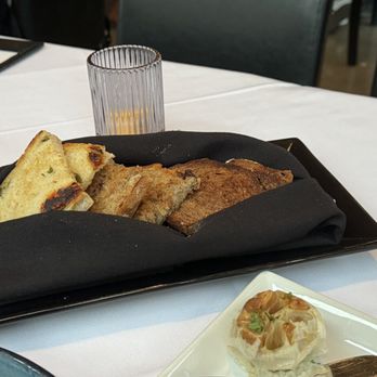 Chez Bacchus - House baked bread served with EVO and aged balsamic $9 - New American Near Me - Long Beach, California