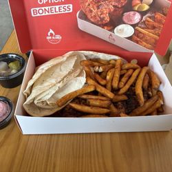 Half chicken platter with fries and flatbread