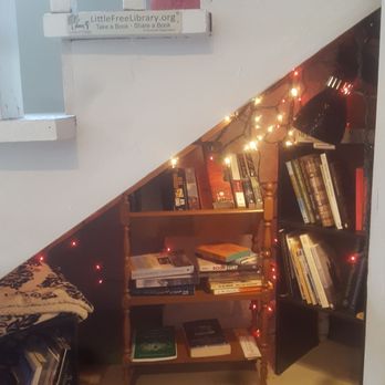 Cafe Zata - This was absolutely adorable. Their Little Library in a Harry Potter stairway nook. - Coffee & Tea Near Me - Richmond, Virginia Cafe Zata - This was absolutely adorable. Their Little Library in a Harry Potter stairway nook. - Coffee & Tea Near Me - Richmond, Virginia