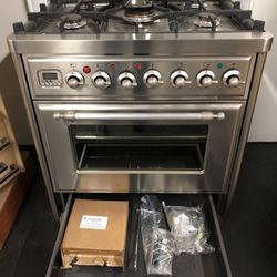 Saddleback Appliances - Rotisserie parts and WOK burner included in warming drawer.