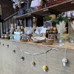 Calathea Home & Gift - Front display table with cute glass mushroom bud vases, great smelling candles and beautiful glass candlesticks.