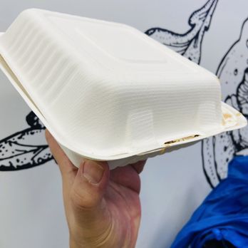 Donair Affair - a hand holding a paper container - Donairs Near Me - Burnaby, British Columbia