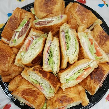 Universal Donuts - Sandwich platter, 4 types, all on croissant bread: pastrami, tuna, turkey and veggies. - Donuts Near Me - El Monte, California