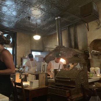Lucali - View from one of the tables of the oven and cash register. - Pizza Near Me - Brooklyn, New York