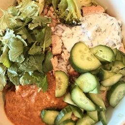 chicken bowl with romaine and rice and the eggplant spread and tzatziki sauce. chicken bowl with romaine and rice and the eggplant spread and tzatziki sauce.