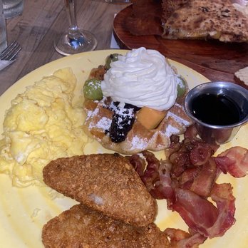 Kaffe Haus - Waffle Platter w/ bacon, hashbrowns, and scrambled eggs. Mimosas, chicken quesadilla and chicken and waffles in background. - Breakfast & Brunch Near Me - San Juan, Puerto Rico Kaffe Haus - Waffle Platter w/ bacon, hashbrowns, and scrambled eggs. Mimosas, chicken quesadilla and chicken and waffles in background. - Breakfast & Brunch Near Me - San Juan, Puerto Rico