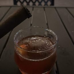 cigar and a glass of alcohol cigar and a glass of alcohol