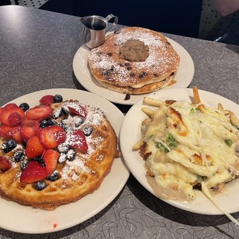Veggie Galaxy - Waffles with mixed berries, Chocolate Chip pancake, and Poutine* - Breakfast & Brunch Near Me - Cambridge, Massachusetts Veggie Galaxy - Waffles with mixed berries, Chocolate Chip pancake, and Poutine* - Breakfast & Brunch Near Me - Cambridge, Massachusetts